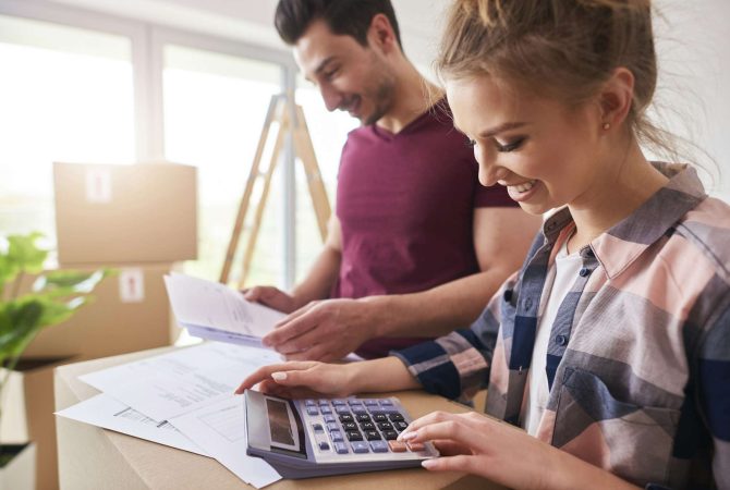 Happy couple planning their budget
